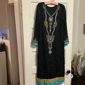 Like new.Hand made n hand embellished black lace. (sheer sleeves) gorgeous sz L